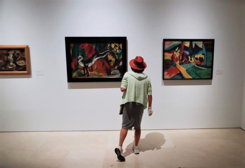 File Photo: A woman watches the exhibition 'Genealogies of the art, or art history as visual art' at the Picasso Museum in Malaga, Spain, May 26, 2020. (REUTERS/Jon Nazca)