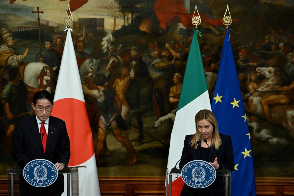 Italy's Prime Minister Giorgia Meloni and Japan's Prime Minister Fumio Kishida address a press conference in Rome's Palazzo Chigi on January 10, 2023. (Photo by Filippo MONTEFORTE / AFP)