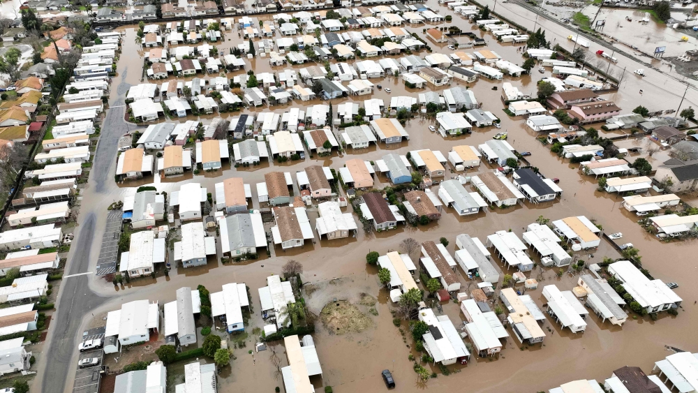  This aerial view shows a flooded neighborhood in Merced, California on January 10, 2023. (Photo by Josh Edelson / AFP)