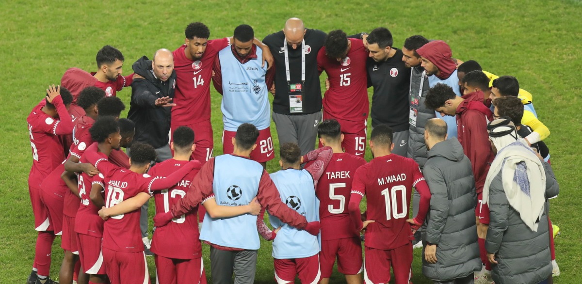 Qatar coach Bruno Pinheiro speaks to players after Tuesday's match. 