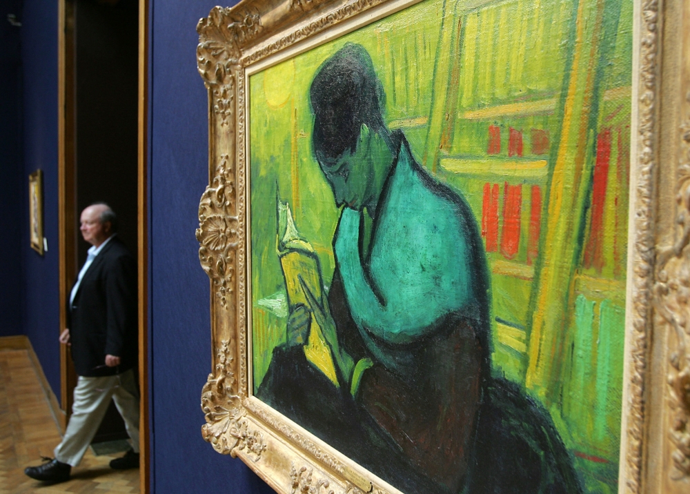 In this file photo taken on June 17, 2005, a man walks past Vincent Van Gogh's 