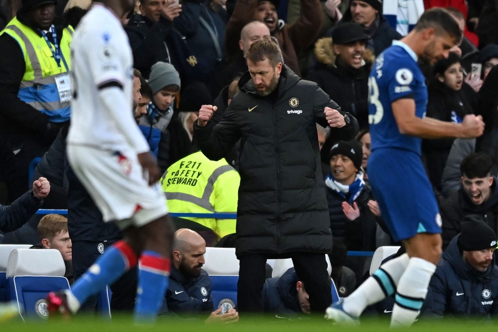 Chelsea's English head coach Graham Potter celebrates on the final whistle in the English Premier League football match between Chelsea and Crystal Palace at Stamford Bridge in London on January 15, 2023. Chelsea won the game 1-0. (Photo by Ben Stansall / AFP)