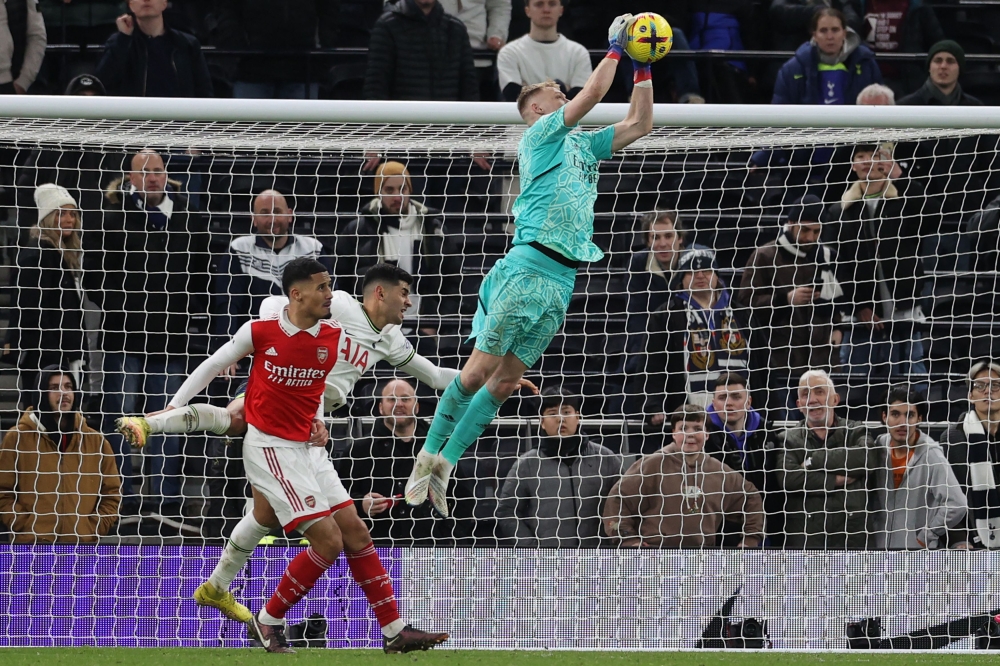 Arsenal's English goalkeeper Aaron Ramsdale catches the ball during the English Premier League match between Tottenham Hotspur and Arsenal at Tottenham Hotspur Stadium in London, on January 15, 2023. (Photo by ADRIAN DENNIS / AFP)