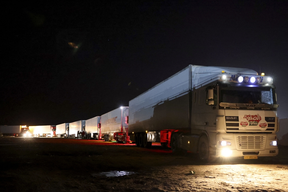 Libyan trucks carrying various food products pass the Ras Jedir border post with Tunisia, early on January 17, 2023. (Photo by Libyan Government of National Unity / AFP)