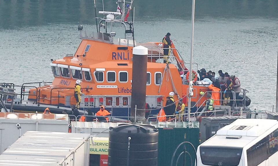 People believed to be migrants disembark a Royal National Lifeboat Institution (RNLI) lifeboat after being rescued from the English Channel while crossing from France, in Dover, Britain, on December 17, 2022. File Photo / Reuters