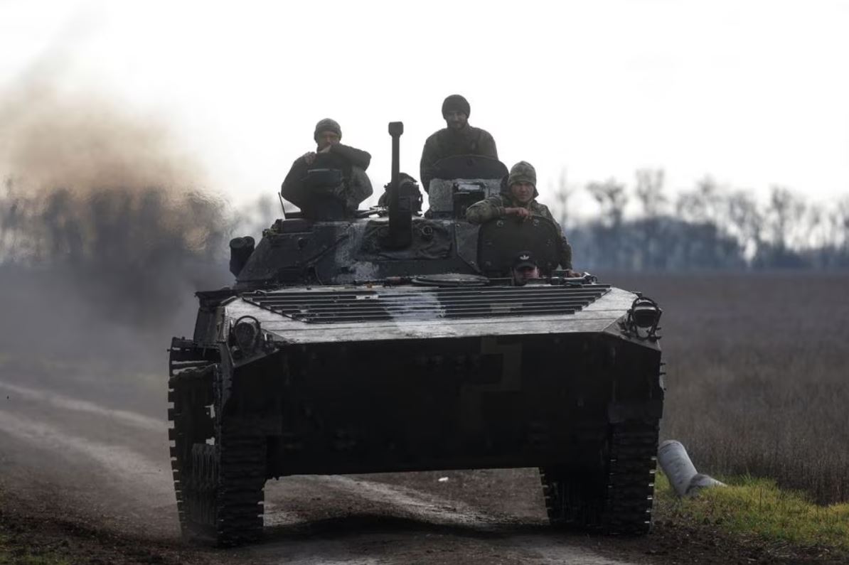 Ukrainian servicemen ride an armoured fighting vehicle, amid Russia's attack on Ukraine, in a frontline in Mykolaiv region, Ukraine, November 4, 2022. (REUTERS/Valentyn Ogirenko)