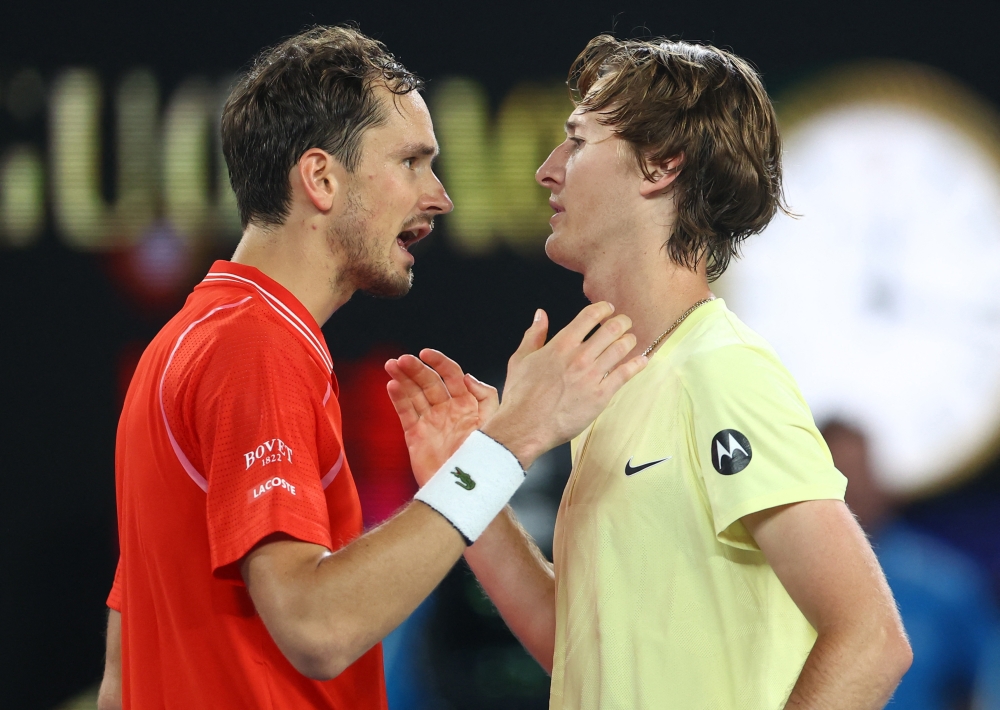Sebastian Korda of the US shakes hands with Russia's Daniil Medvedev after winning his third round match at the Australian Open in Melbourne Park, Melbourne, Australia, January 21, 2023. (REUTERS/Hannah Mckay)