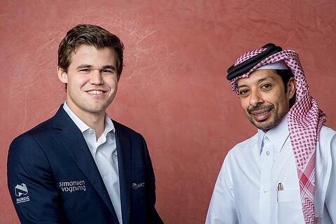 Norway's Magnus Carlsen with QCF President Mohammed Al Madhahka. 