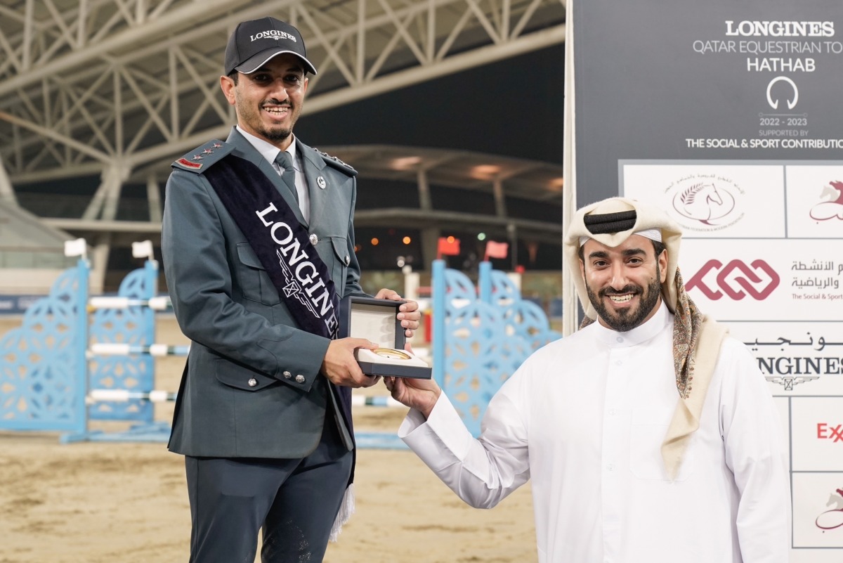 Director of Joint Services Department, The Social & Sport Contribution Fund (Daam), Yousef Mohammed Al Nuaimi presents the winner's trophy to Faleh Suwead Al Ajami.