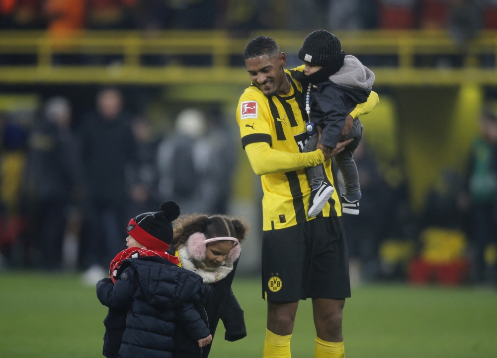 Borussia Dortmund's Sebastien Haller with family celebrate after the Borussia Dortmund v FC Augsburg match at the Bundesliga, Signal Iduna Park, Dortmund, Germany, January 22, 2023. (REUTERS/Leon Kuegeler)