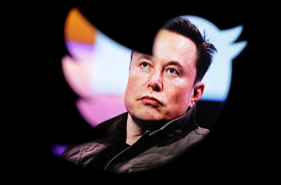 Elon Musk's photo is seen through a Twitter logo in this illustration taken October 28, 2022. File Photo: Reuters/Dado Ruvic





