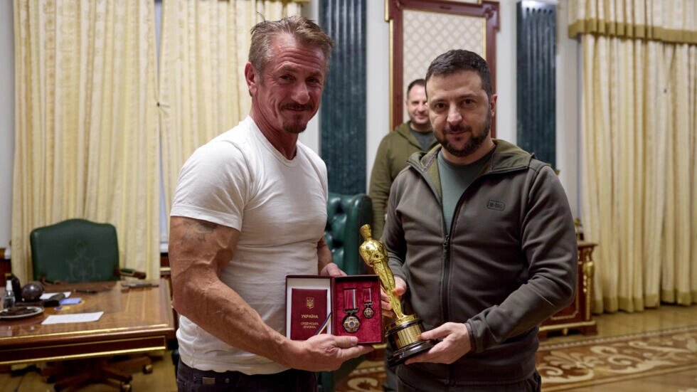 Sean Penn, left, with Ukraine's President Volodymyr Zelensky. The actor was in Kiev when Russia invaded Ukraine. STR / UKRAINIAN PRESIDENTIAL PRESS SERVICE/AFP
