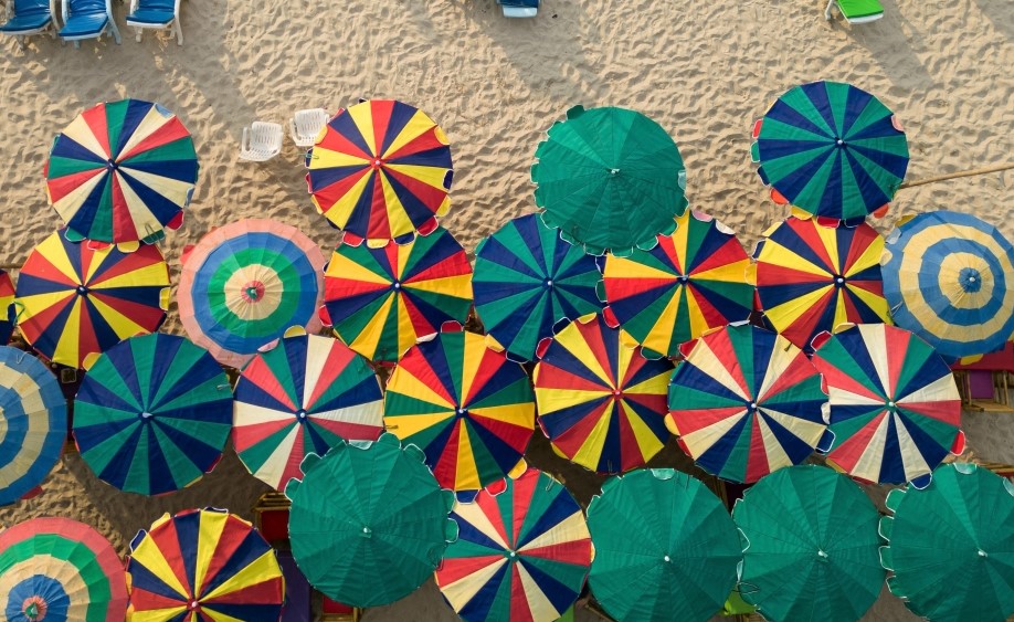 Colourful umbrellas are seen in a restaurant as tourists enjoy a beach on the island of Phuket in Thailand on January 19, 2023. (REUTERS/Jorge Silva)