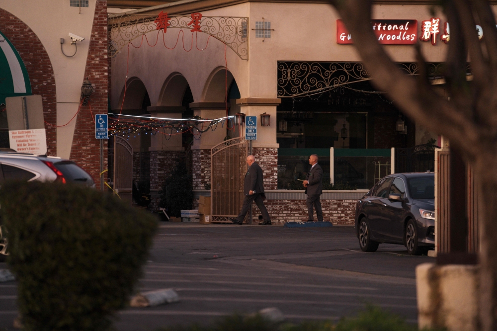 Members of law enforcement investigate the scene of a deadly shooting on January 22, 2023 in Monterey Park, California. 10 people were killed and 10 more were injured at a dance studio in Monterey Park near a Lunar New Year celebration on Saturday night. Eric Thayer/Getty Images/AFP 