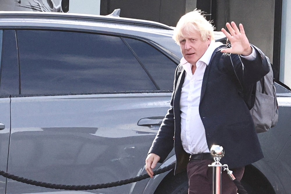 Former British Prime Minister Boris Johnson at Gatwick Airport, near London, Britain, October 22, 2022. (REUTERS/Henry Nicholls)
