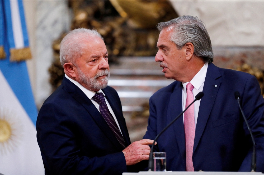 Brazil's President Luiz Inacio Lula da Silva and Argentina's President Alberto Fernandez attend a bilateral agreement signing ceremony, during Lula da Silva's first official visit abroad since his inauguration, at the Casa Rosada presidential palace in Buenos Aires, Argentina, on January 23, 2023. REUTERS/Agustin Marcarian