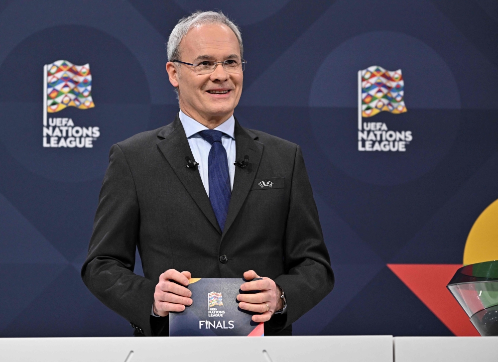 UEFA director of competitions Giorgio Marchetti introduces the 2023 UEFA Nations League football finals draw in Nyon, Switzerland, on January 25, 2023.  (Photo by Fabrice COFFRINI / AFP)