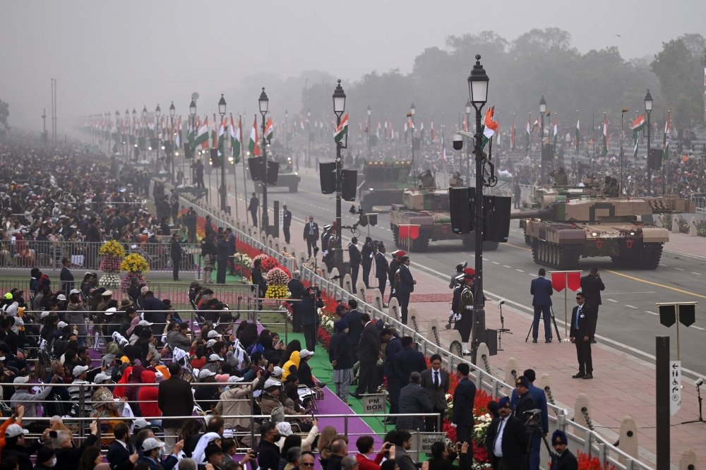 Spectators watch India's 74th Republic Day parade in New Delhi on January 26, 2023. (Photo by Money Sharma/ AFP)