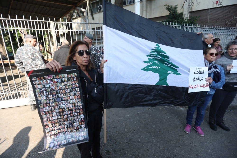Families of the victims of the 2020 port blast take part in a protest against Lebanon's top public prosecutor who charged the judge investigating the blast and ordered the release of those detained in connection with the explosion in front of the Justice Palace in Beirut, Lebanon January 26, 2023. REUTERS/Aziz Taher