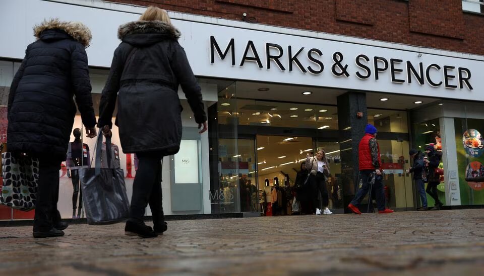 Shoppers walk past a branch of Marks and Spencer in Altrincham, Britain on January 7 2020. File Photo / Reuters
