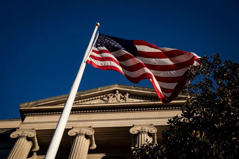 An American flag waves outside the US Department of Justice Building in Washington, US, on December 15, 2020. File Photo / Reuters