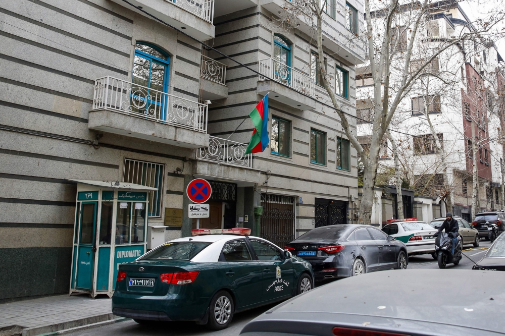 Police stay guard in front of the Azerbaijan embassy in Tehran on January 27, 2023, following an attack. File Photo: AFP


