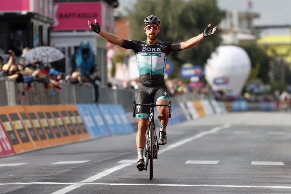 In this file photo taken on October 13, 2020 Team Bora rider Slovakia's Peter Sagan celebrates as he crosses the finish line in the 10th stage of the Giro d'Italia 2020 cycling race, a 177-kilometer route between Lanciano and Tortoreto. Photo by Luca Bettini / AFP