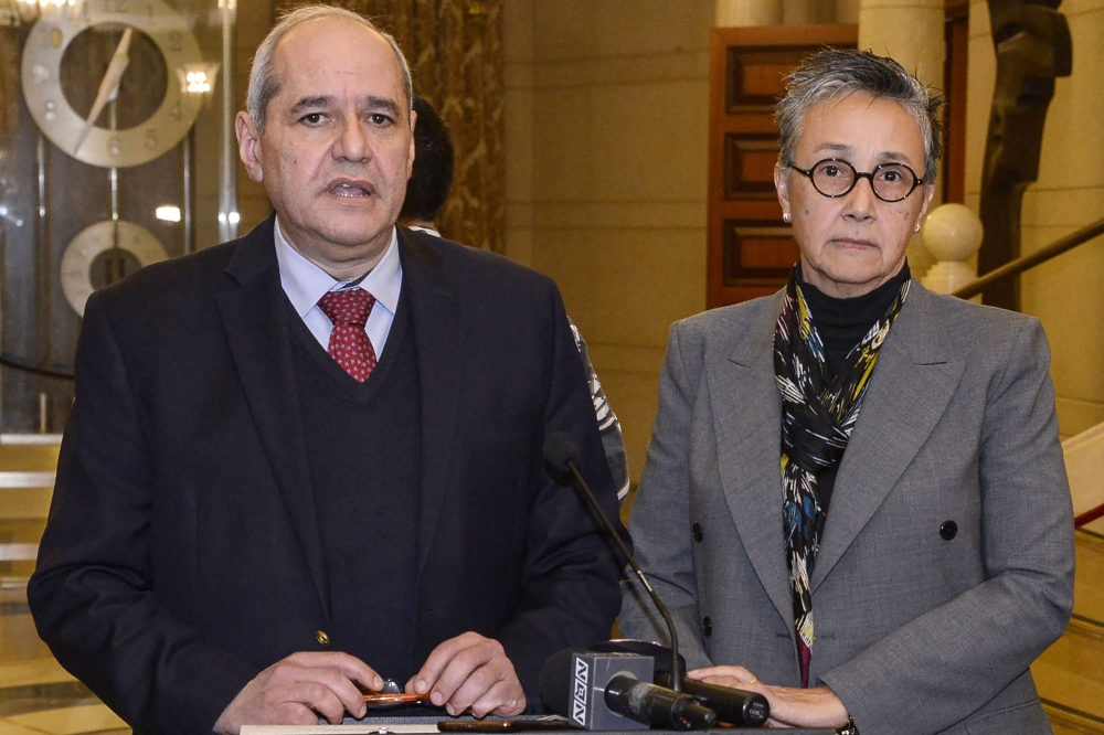 Lebanese deputies Melhem Khalaf (left) and Najat Saliba giving a statement to the press at the end of a session in the parliament building, in the capital Beirut, in this handout photo provided by the Lebanese Parliament on January 19, 2023. (AFP)