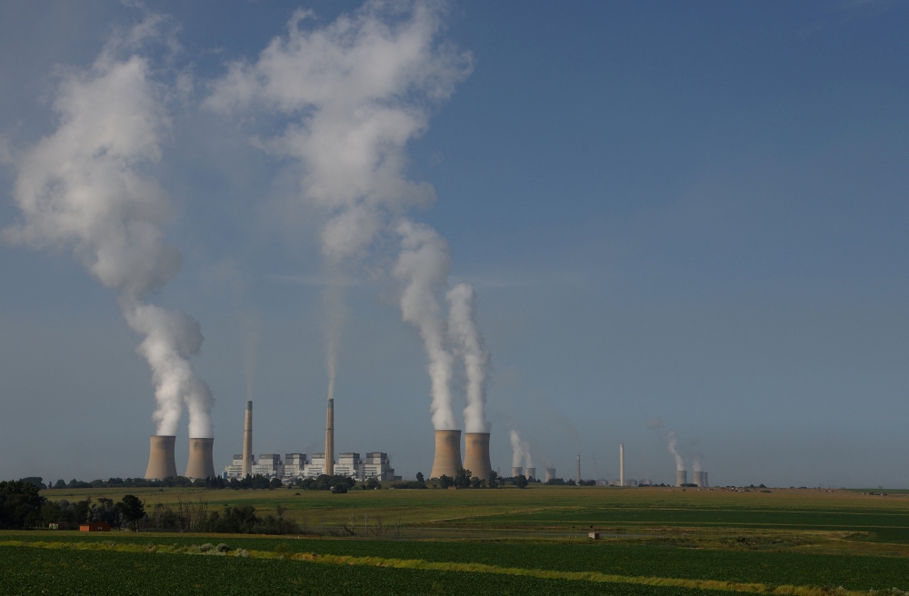Smoke billows from the cooling towers of Kriel and Matla Power Stations, coal-fired stations of South African utility Eskom, as the company's ageing coal-fired plants cause frequent power outages, in Kriel, in the Mpumalanga province, South Africa, January 17, 2023. (REUTERS/Siphiwe Sibeko)