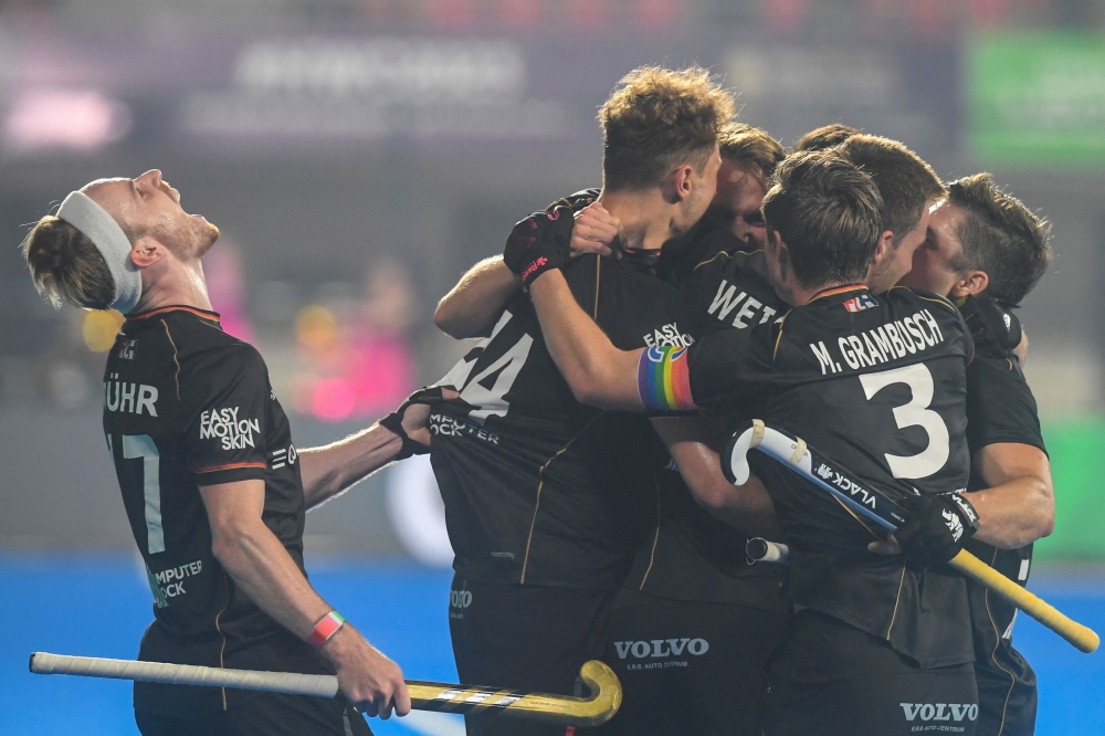 German players celebrate after scoring the winning goal during the men's semi-final match between Australia and Germany at the FIH Odisha Field hockey Men's World Cup 2023, in Bhubaneswar on January 27, 2023. (Photo by Dibyangshu Sarkar / AFP)