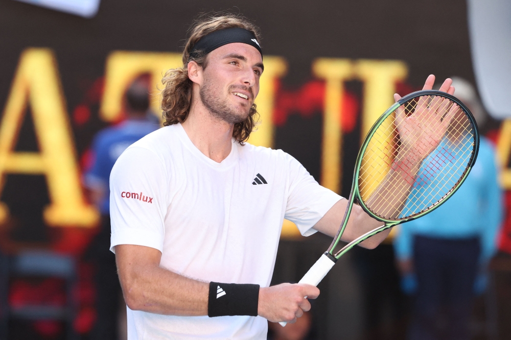 Greece's Stefanos Tsitsipas celebrates after victory against Russia's Karen Khachanov during their men's singles semi-final match on day twelve of the Australian Open tennis tournament in Melbourne on January 27, 2023. (Photo by Martin Keep/ AFP)
