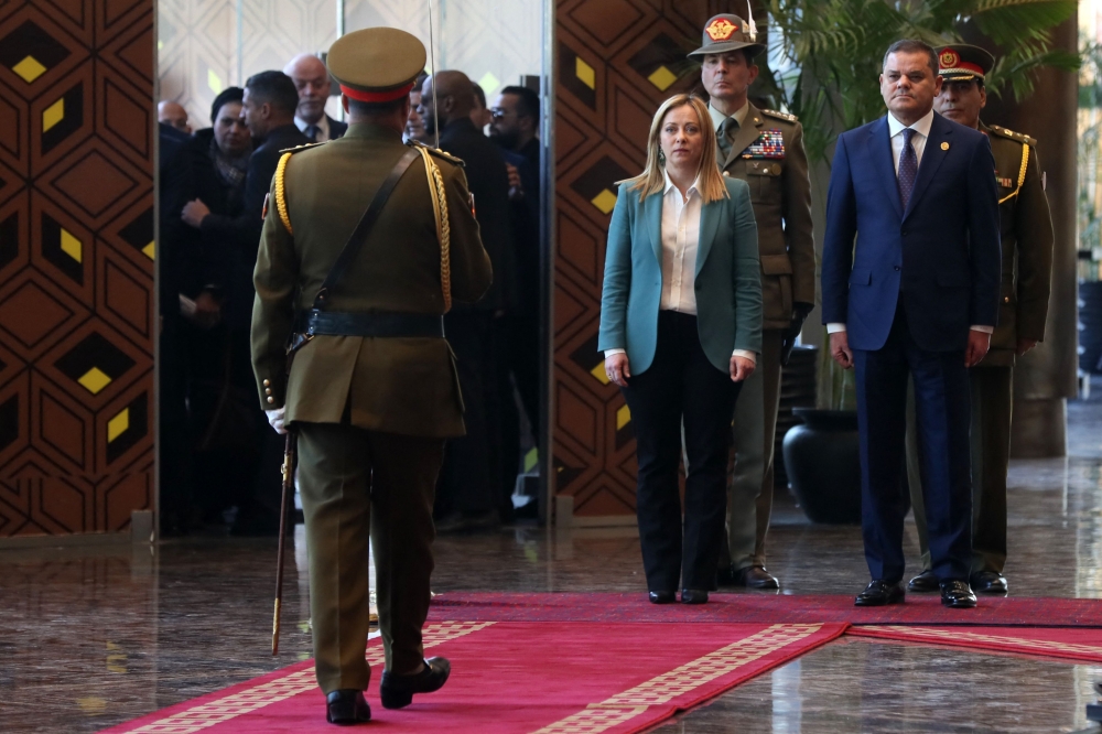 Libya's Tripoli-based Prime Minister Abdulhamid Dbeibah receives his Italian counterpart Giorgia Meloni, in the capital Tripoli, on January 28, 2023. (Photo by Mahmud Turkia / AFP)