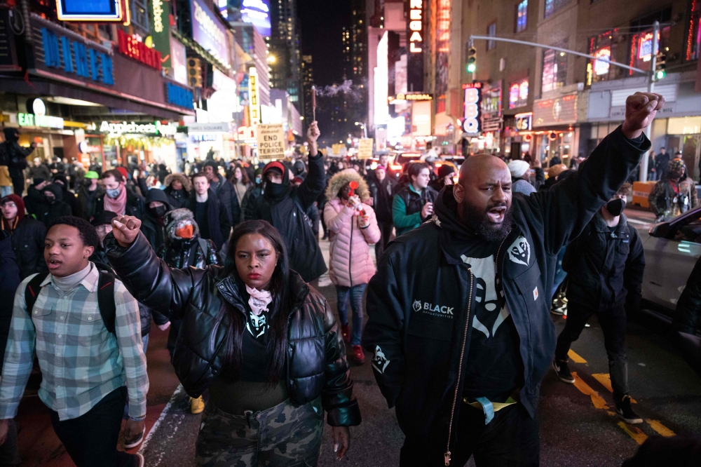 Protesters rally against the fatal police assault of Tyre Nichols, at Times Square in New York City, on January 27, 2023.  (Photo by Yuki IWAMURA / AFP)