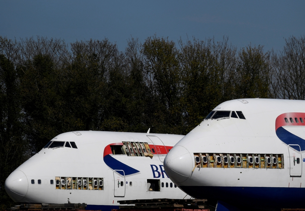 File Photo: Decommissioned British Airways Boeing 747 jumbo jets, partially dismantled, are seen parked to be used for salvage and parts after the airline retired its whole 747 fleet, amidst the spread of the coronavirus disease (COVID-19) pandemic, Cotswold Airport, Kemble, Britain, April 23, 2021. (REUTERS/Toby Melville)