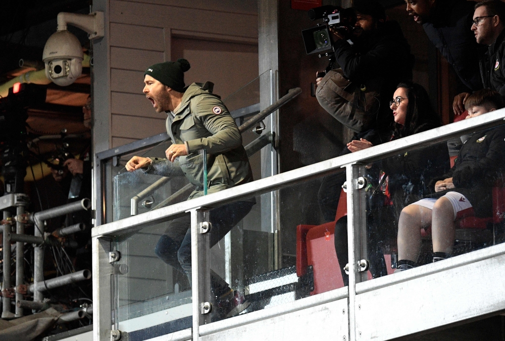 US actor and Wrexham owner Ryan Reynolds reacts during the English FA Cup fourth round football match between Wrexham and Sheffield United at the Racecourse Ground Stadium in Wrexham, north Wales, on January 29, 2023. (Photo by Oli SCARFF / AFP) 