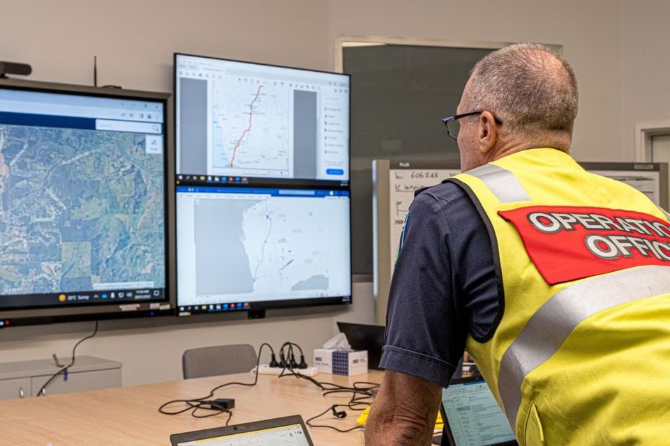A member of the Incident Management Team coordinates the search for a radioactive capsule that was lost in transit by a contractor hired by Rio Tinto, at the Emergency Services Complex in Cockburn, Australia, in this undated handout photo. Department of Fire and Emergency Services/Handout via REUTERS
