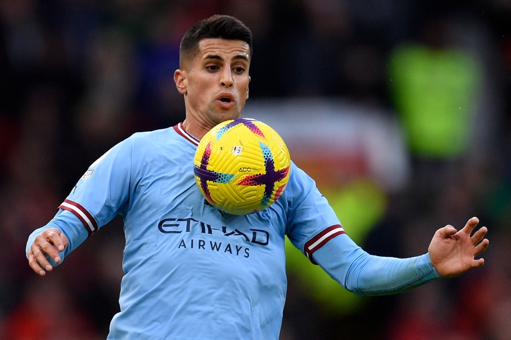 This file photo taken on January 14, 2023 shows Manchester City's Portuguese defender Joao Cancelo controlling the ball during the English Premier League football match between Manchester United and Manchester City at Old Trafford in Manchester, north west England. Photo by Oli SCARFF / AFP
