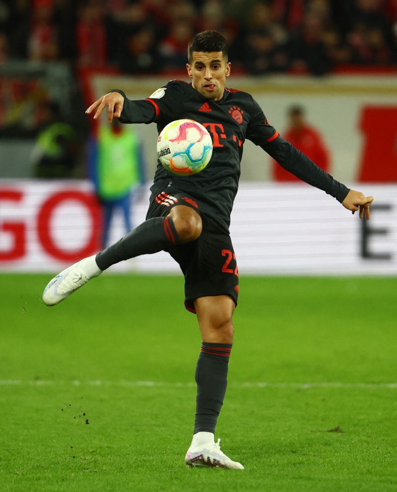 Soccer Football - DFB Cup - Round of 16 - 1. FSV Mainz 05 v Bayern Munich - MEWA Arena, Mainz, Germany - February 1, 2023 Bayern Munich's Joao Cancelo in action REUTERS/Kai Pfaffenbach