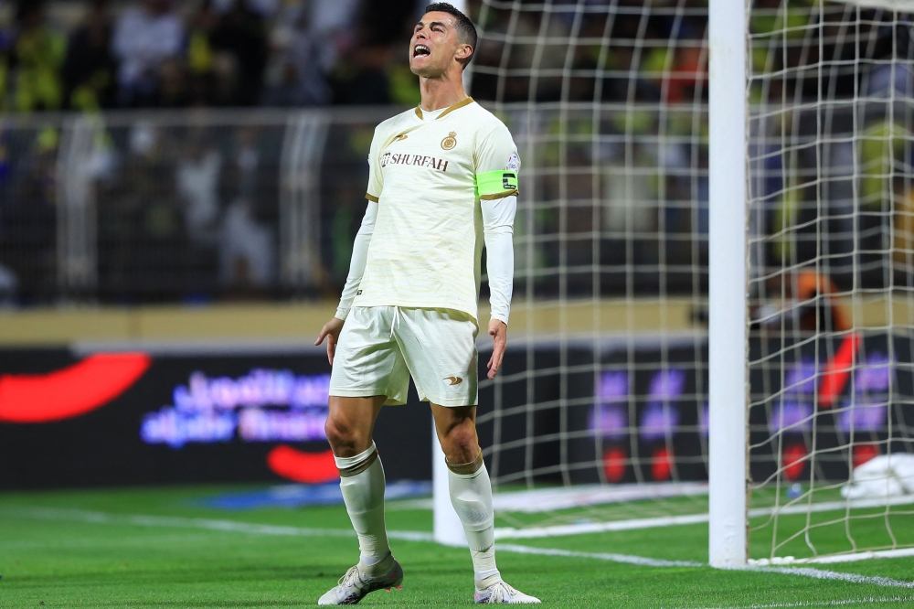 Nassr's Portuguese forward Cristiano Ronaldo reacts the Saudi Pro League football match between Al-Fateh and Al-Nassr at the Prince Abdullah bin Jalawi Stadium in al-Hasa on February 3, 2023. (Photo by Ali Aldaif / AFP)