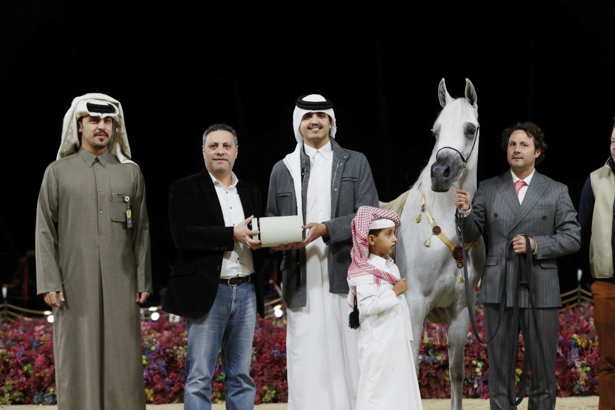 H E Sheikh Thani bin Hamad Al Thani with a winner of Arabian Peninsula Horse show.