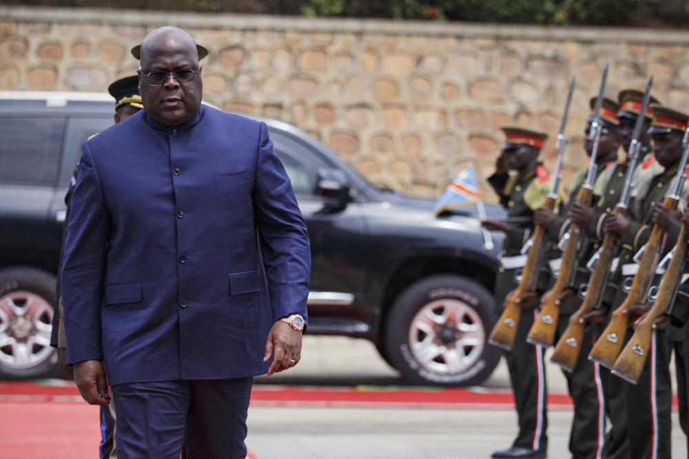 President of the Democratic Republic of the Congo Felix Tshisekedi inspects the guard of honor upon arrival during the extraordinary Summit of East African Community Heads of State at the state house in Bujumbura, Burundi, on February 4, 2023. (Photo by Tchandrou Nitanga / AFP)