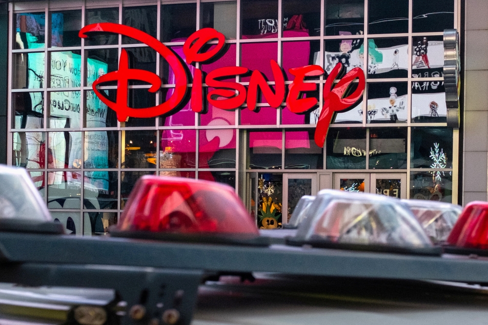FILE PHOTO: The logo of the Times Square Disney store is seen in Times Square, New York City, U.S. December 5, 2019. REUTERS/Nick Pfosi/File Photo