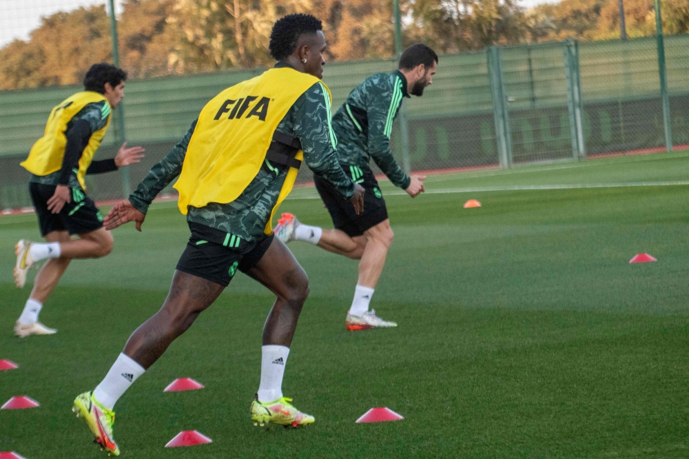 Real Madrid's Brazilian forward Vinicius Junior (right) attends a training session in Rabat on February 7, 2023, on the eve of the FIFA Club World Cup semi-final football match against Egypt's Al-Ahly. (Photo by AFP)