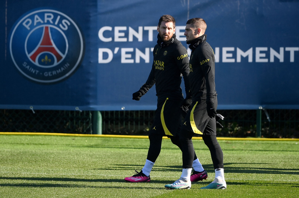 File photo: Paris Saint Germain's Argentinian forward Lionel Messi (left) and Italian midfielder Marco Veratti arrive for a training session at Sain-Germain-en-Laye. AFP