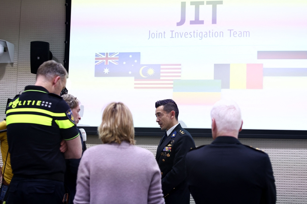 Dutch head of the National Crime Investigations Division Andy Kraag answers journalists questions after a press conference on the results of the ongoing investigation into other parties involved in the downing of flight MH17 at EU Agency for Criminal Justice Cooperation (Eurojust) headquarters in The Hague on February 8, 2023. (Photo by Kenzo Tribouillard / AFP)