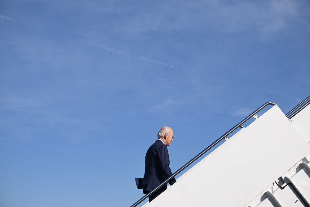 US President Joe Biden walks to board Air Force One at Joint Base Andrews in Maryland on February 8, 2023. - Biden is travelling to Wisconsin to speak about his economic plan. (Photo by Mandel NGAN / AFP)