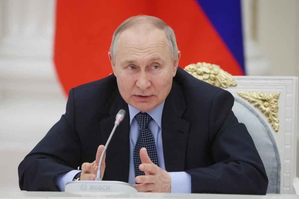 Russian President Vladimir Putin meets with representatives of the country's aviation industry at the Kremlin in Moscow on February 9, 2023. (Photo by Mikhail METZEL / SPUTNIK / AFP)