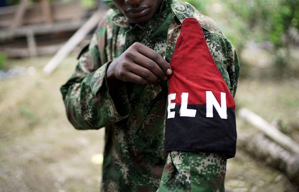 A rebel of Colombia's Marxist National Liberation Army (ELN) shows his armband while posing for a photograph, in the northwestern jungles, Colombia August 31, 2017. REUTERS/Federico Rios/File Photo