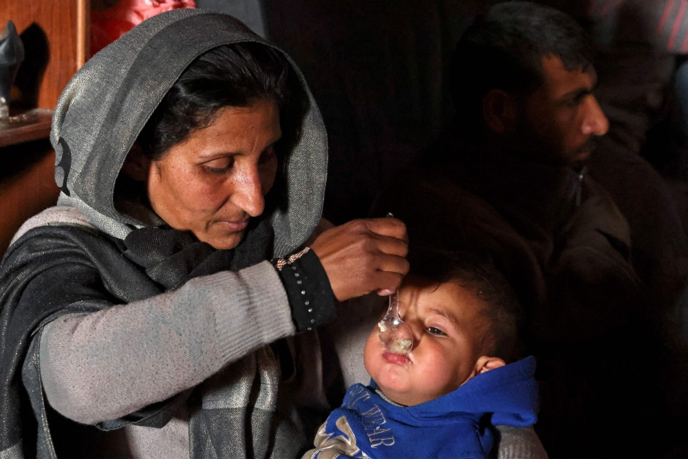 Displaced Syrians take refuge at the Sultan Ibrahim Mosque in the regime-controlled town of Jableh, northwest of the capital Damascus, on February 12, 2023 following a deadly earthquake in Turkey and Syria. (Photo by Karim Sahib / AFP)