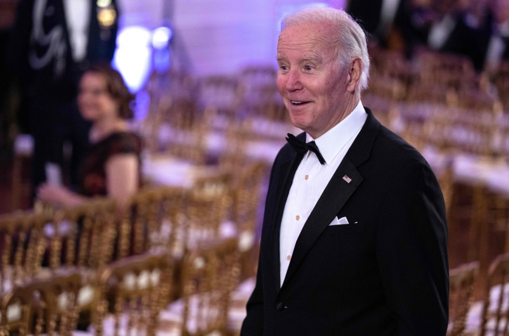 US President Joe Biden arrives for the entertainment portion of the evening after a black-tie dinner for Governors and their spouses at the White House in Washington, DC on February 11, 2023. (Photo by ANDREW CABALLERO-REYNOLDS / AFP)
 
